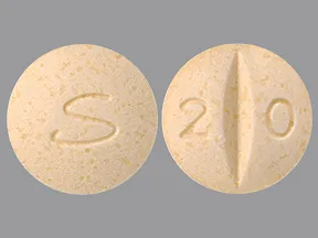 This medicine is a yellow, round, scored, tablet imprinted with 