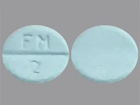 This medicine is a light blue, round, scored, tablet imprinted with 