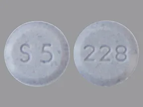 This medicine is a light purple, round, tablet imprinted with 