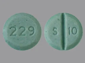This medicine is a light green, round, scored, tablet imprinted with 
