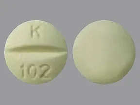 This medicine is a light yellow, round, scored, tablet imprinted with 