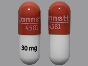 This medicine is a reddish-brown white, oblong, capsule imprinted with 