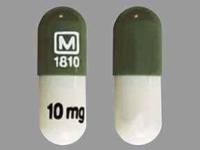 This medicine is a white dark green, oblong, capsule imprinted with 