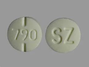This medicine is a pale yellow, round, scored, tablet imprinted with 