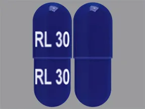 This medicine is a dark blue, oblong, capsule imprinted with 