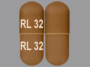 This medicine is a caramel, oblong, capsule imprinted with 