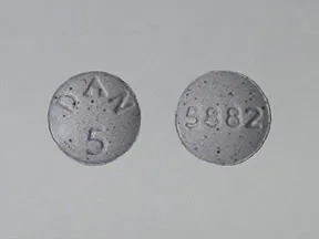 This medicine is a purple, round, tablet imprinted with 