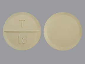 This medicine is a yellow, round, scored, tablet imprinted with "T  18".