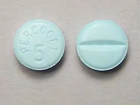 This medicine is a blue, round, scored, tablet imprinted with "PERCOCET  5".