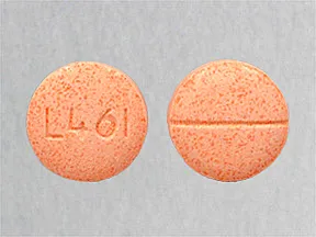 This medicine is a orange, round, scored, orange, chewable tablet imprinted with "L461".