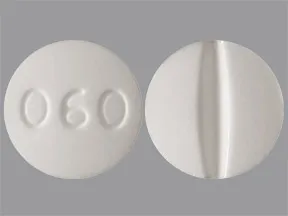 This medicine is a white, round, scored, tablet imprinted with "060".