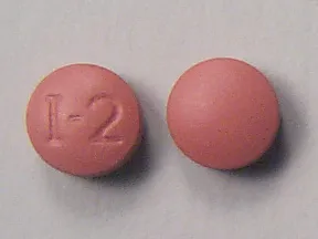 This medicine is a brown, round, film-coated, tablet imprinted with "I-2".