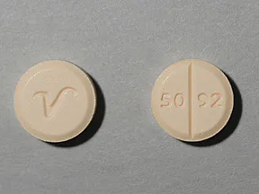 This medicine is a peach, round, scored, tablet imprinted with "50 92" and "logo".