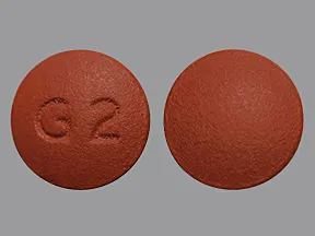 This medicine is a brown, round, tablet imprinted with "G2".