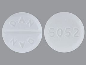 This medicine is a white, round, scored, tablet imprinted with "DAN  DAN" and "5052".