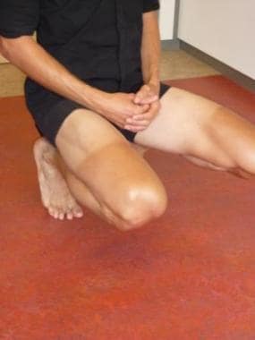 Patient in a squatting position for a hyperflexion