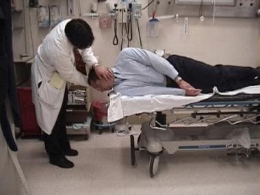 Epley maneuver. Guide the patient's head down so t