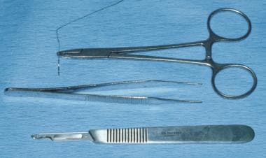 A No. 15 Bard-Parker blade, atraumatic forceps, an