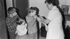 Collect More Data or Begin Widespread Distribution? An Historical Perspective on the Vaccine Test Dilemma