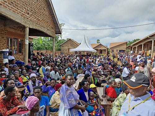 Patients waiting outside a care site in Uganda