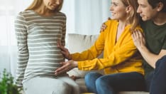 photo of The cheerful surrogate mother gives her baby to the childless family.