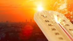 photo of High-temperature thermometer for hot summer weather with city view