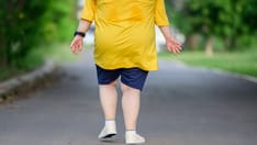 photo of  Rear view fat asian girl exercise walking to burn fat and jogging slowly fat woman walking for exercise
