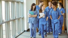 photo of Medical students walking down the hallway at the university
