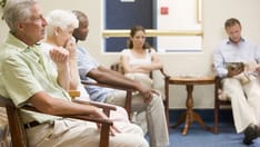 photo of Five people waiting in waiting room.