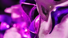 photo of Abstract background ultra violet Venetian masquerade mask