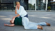 photo of Passerby making emergency call for. Passerby near unconscious elderly women making emergency call