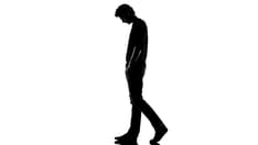 photo of Sad young man silhouette walking. Sad young man walking silhouette in studio isolated on white background