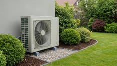 photo of Modern outdoor air conditioner with green garden. ai generated