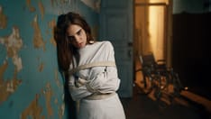 photo of Female patient in a straitjacket, psychiatric hospital. Unstable female patient in a straitjacket, psychiatric hospi