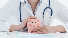photo of Female doctor and piggy bank: health insurance, medical expenses and tax concept