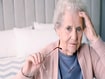 photo of Senior woman with headache
