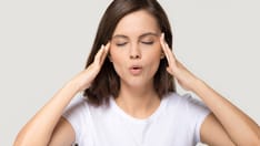 photo of woman trying to calm her nerves