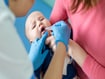 photo of baby getting oral vaccination