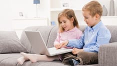 photo of kids watching a scren