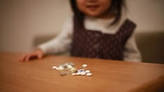 photo of kid and pills