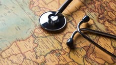 photo of stethoscope on a map