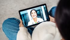 photo of doctor and patient on a video call