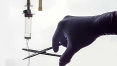 photo of scissors cutting an IV