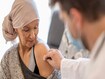 photo of a cancer patient receiving vaccine