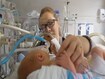 photo of a doctor checking on a premature baby