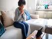photo of Sick woman having video call with doctor