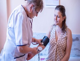photo of a doctor and patient