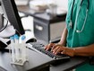 photo of a doctor on a computer