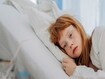 photo of a sick child in bed.