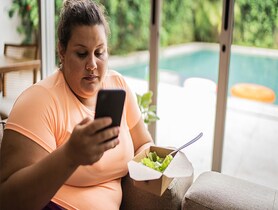 photo of an obese woman on a phone